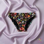 Period panties for moderate flow, with colorful flowers on black base