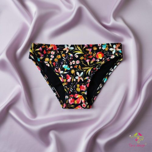 Period panties for moderate flow, with colorful flowers on black base