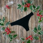 Black period panties in thong style, with white lace