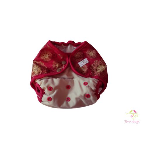 Diaper cover with gold tendril pattern